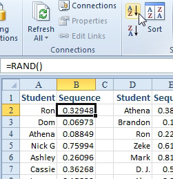 A column of =RAND() next to the student names. Every time that you sort by the RAND column, the names will re-sequence.